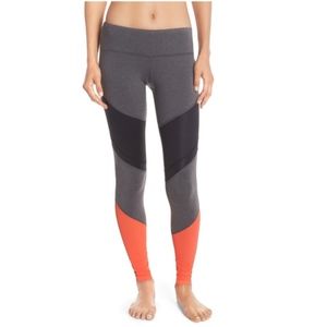 ALO Yoga gray, black, and orange detailed leggings